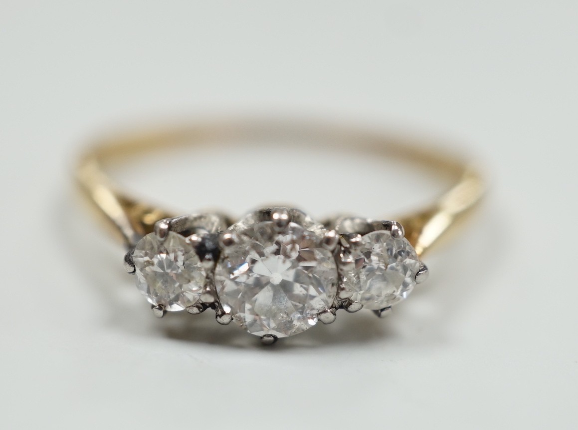 An 18ct and three stone diamond set ring, size, T/U, gross weight 2.9 grams